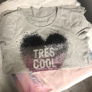 Two piece outfit. T-shirt and crop leggings